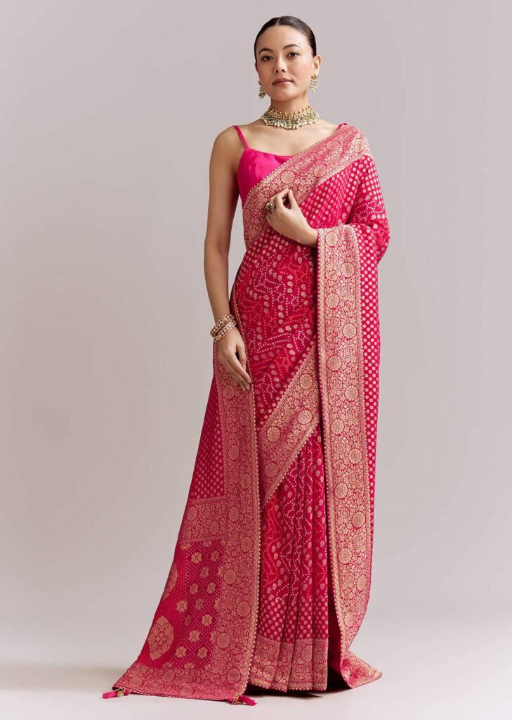 Pink Georgette Woven Saree With Floral Border And Bandhani Print
