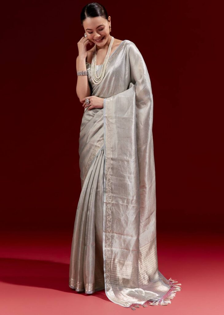 Metallic Blue Banarasi Tissue Saree With Micro Geometric Weave And Floral Woven Border

